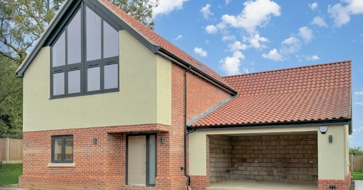 Modern new build home at Dairy Farm development in Ormesby St Margaret, Norfolk, designed by Norfolk architects Paul Robinson Partnership, showcasing contemporary rural architecture with traditional materials.